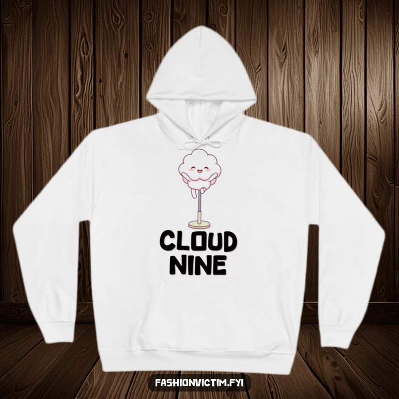 Funny hoodie showing a fluffy cloud character joyfully leaping over a mannequin leg, offering warmth and a spirit of carefree delight.