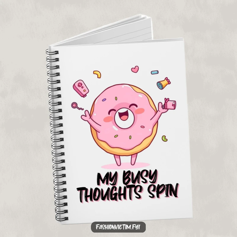 Funny notebook with a pink donut character joyfully juggling tiny, colorful accessories, perfect for journaling creative thoughts and sweet ideas.